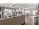 An open concept living space shows seating, a kitchen, and a dining area at 102 Jacobs Farm Ln # 40, Lawrenceville, GA 30045