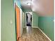 Cozy attic room featuring sloped ceilings, wood floors, and multiple storage areas at 11072 Shannon Cir, Hampton, GA 30228
