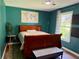 Charming bedroom with stylish laminate flooring, a comfortable bed, and ample natural light at 11072 Shannon Cir, Hampton, GA 30228