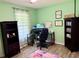 A delightful bedroom showcasing laminate flooring, a ceiling fan, and an open concept feel at 11072 Shannon Cir, Hampton, GA 30228