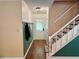 Inviting entryway with wood floors, coat rack, and a staircase leading to the upper level at 11072 Shannon Cir, Hampton, GA 30228