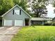 Charming home with a two-car garage and well-maintained lawn with mature trees at 11072 Shannon Cir, Hampton, GA 30228