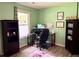 Bright office with hardwood floors, a large window, and ample desk space at 11072 Shannon Cir, Hampton, GA 30228