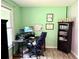 Bright office space with a modern desk setup, sleek monitor, and stylish decor accents at 11072 Shannon Cir, Hampton, GA 30228