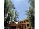 New construction showing the framed structure with the roof being installed against a beautiful blue sky at 1330 Twelve Oaks Nw Cir, Atlanta, GA 30327