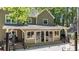 Back exterior with a large deck area and sliding glass doors for indoor/outdoor living at 4320 Oklahoma Nw Way, Kennesaw, GA 30152