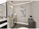 This bathroom features a vanity, a large mirror, storage cabinet and hardwood floors at 4320 Oklahoma Nw Way, Kennesaw, GA 30152