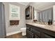 This bathroom features a granite countertop, wood floors, and updated fixtures at 4320 Oklahoma Nw Way, Kennesaw, GA 30152