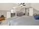 This bedroom features ample space, a crib, and a comfortable lounging area at 4320 Oklahoma Nw Way, Kennesaw, GA 30152