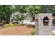 Lovely home with a two-car garage, well-kept landscaping, and a mailbox with house numbers on a brick base at 4320 Oklahoma Nw Way, Kennesaw, GA 30152