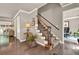 This foyer is enhanced by hardwood floors, a staircase with carpet, and decorative accents at 4320 Oklahoma Nw Way, Kennesaw, GA 30152