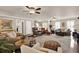 Bright and airy living area featuring hardwood floors, ceiling fans, and neutral wall colors at 4320 Oklahoma Nw Way, Kennesaw, GA 30152