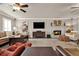 Spacious living room featuring neutral walls, a fireplace, and comfortable seating at 4320 Oklahoma Nw Way, Kennesaw, GA 30152