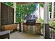 Outdoor kitchen area featuring a built-in grill, stainless steel storage, and a wooden prep table at 4320 Oklahoma Nw Way, Kennesaw, GA 30152