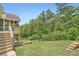 Spacious backyard with lawn and stairs leading to upper deck at 46 Grand Georgian Ne Ct, Cartersville, GA 30121