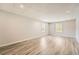 Finished basement with stylish wood flooring, recessed lighting, and bright windows at 46 Grand Georgian Ne Ct, Cartersville, GA 30121
