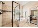 Luxurious bathroom features a walk-in shower, soaking tub, and tile surround at 46 Grand Georgian Ne Ct, Cartersville, GA 30121
