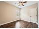 Comfortable bedroom with natural light, hardwood floors, and a ceiling fan at 46 Grand Georgian Ne Ct, Cartersville, GA 30121