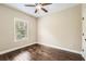 Bright bedroom with hardwood floors, a window, and neutral paint at 46 Grand Georgian Ne Ct, Cartersville, GA 30121