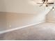 Spacious bonus room with neutral carpet, ceiling fans, and ample natural light at 46 Grand Georgian Ne Ct, Cartersville, GA 30121