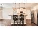 Open kitchen featuring stainless steel appliances, granite counters, bar seating and hardwood floors at 46 Grand Georgian Ne Ct, Cartersville, GA 30121