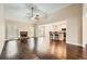 Open living room features hardwood floors, fireplace and access to the kitchen with bar seating at 46 Grand Georgian Ne Ct, Cartersville, GA 30121