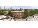 Aerial view of the building showcasing its brick exterior, red window frames, and surrounding cityscape at 572 Edgewood Se Ave # 303, Atlanta, GA 30312