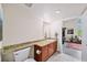 This bathroom includes a granite countertop vanity and an open doorway to the living room at 572 Edgewood Se Ave # 303, Atlanta, GA 30312