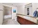 Bathroom with granite countertop vanity, walk-in closet, and separate tiled tub/shower at 572 Edgewood Se Ave # 303, Atlanta, GA 30312