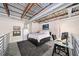 Cozy loft bedroom featuring a bed, desk, and stylish decor under an industrial-style ceiling at 572 Edgewood Se Ave # 303, Atlanta, GA 30312