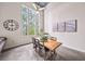 Bright dining area with a large window, wooden table, and modern decor creating an inviting atmosphere at 572 Edgewood Se Ave # 303, Atlanta, GA 30312