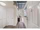 Inviting entryway with a view into the living space, featuring industrial ceilings and modern decor at 572 Edgewood Se Ave # 303, Atlanta, GA 30312