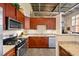 Modern kitchen with stainless steel appliances, granite countertops, and ample cabinet space at 572 Edgewood Se Ave # 303, Atlanta, GA 30312