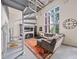 Open-concept living area with spiral staircase, large windows, and comfortable seating at 572 Edgewood Se Ave # 303, Atlanta, GA 30312