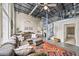Comfortable living room with high ceilings, spiral staircase, and open layout to other living areas at 572 Edgewood Se Ave # 303, Atlanta, GA 30312