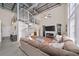 Spacious living room with a spiral staircase, comfortable seating, and an open-concept layout at 572 Edgewood Se Ave # 303, Atlanta, GA 30312