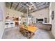 Open living space showcasing the kitchen, dining area, and living room with high ceilings and industrial accents at 572 Edgewood Se Ave # 303, Atlanta, GA 30312