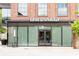 Exterior shot of The Salty, complete with glass storefront and minimalist seating at 572 Edgewood Se Ave # 303, Atlanta, GA 30312