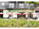 Exterior shot of Emerald City Bagels, featuring green tables and pink umbrellas at 572 Edgewood Se Ave # 303, Atlanta, GA 30312