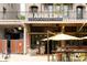 Exterior view of Hawkers Asian Street Food, with outdoor seating and signage at 572 Edgewood Se Ave # 303, Atlanta, GA 30312