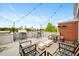 Rooftop deck with seating area, cafe lights, and city views at 572 Edgewood Se Ave # 303, Atlanta, GA 30312