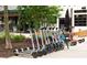 Numerous Bird brand electric scooters sit on a sidewalk for quick transportation at 572 Edgewood Se Ave # 303, Atlanta, GA 30312