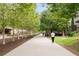 Manicured walking path lined by mature trees and leading past outdoor restaurants at 572 Edgewood Se Ave # 303, Atlanta, GA 30312