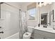 Bright bathroom featuring a shower-tub, toilet and a vanity with great lighting at 106 Jacobs Farm Ln # 42, Lawrenceville, GA 30045