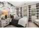 Stylized bedroom featuring a floral accent wall and modern decor at 106 Jacobs Farm Ln # 42, Lawrenceville, GA 30045