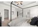 Bedroom features a ceiling fan, tray ceiling, and entry to the walk-in closet at 106 Jacobs Farm Ln # 42, Lawrenceville, GA 30045