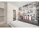 Beautiful bedroom with a large floral accent wall and a well-lit closet at 106 Jacobs Farm Ln # 42, Lawrenceville, GA 30045