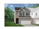 Charming two-story home with a brick and siding facade, complemented by a two-car garage and well-manicured lawn at 106 Jacobs Farm Ln # 42, Lawrenceville, GA 30045