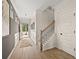 Inviting foyer with hardwood floors, elegant wainscoting, and a staircase leading to the upper level at 106 Jacobs Farm Ln # 42, Lawrenceville, GA 30045