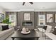 Comfortable living room with a stylish fireplace, modern decor, and ample seating at 106 Jacobs Farm Ln # 42, Lawrenceville, GA 30045